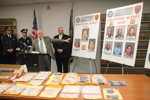 District attorney Thomas Spota points to the suspects arrested in a heroin trafficking ring at a press conference Wednesday. (Photo by Paul Squire)
