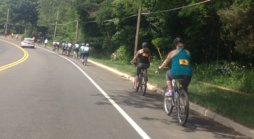 Cyclists ride along Main Road in Southold. (Credit: Joseph Pinciaro)