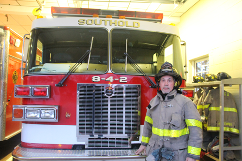 (Photo by Paul Squire) Captain Barry Standish at Southold Fire Department headquarters.