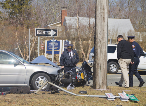 Southold Town police investigate the scene of Thursday morning's crash. (Credit: Paul Squire)