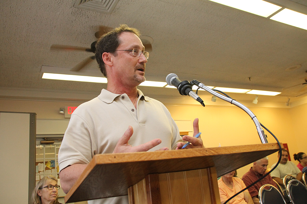 Robert DeLuca, CEO of Group for the East End, speaks at a public hearing Monday night. (Credit: Paul Squire)
