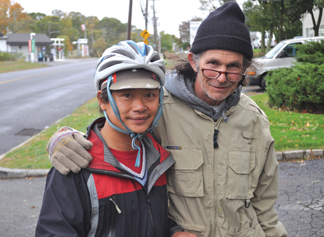 Jason Tang, left, with David Markel of Southold the morning after they met during a nor'easter last week. (Credit: Joe Werkmeister)