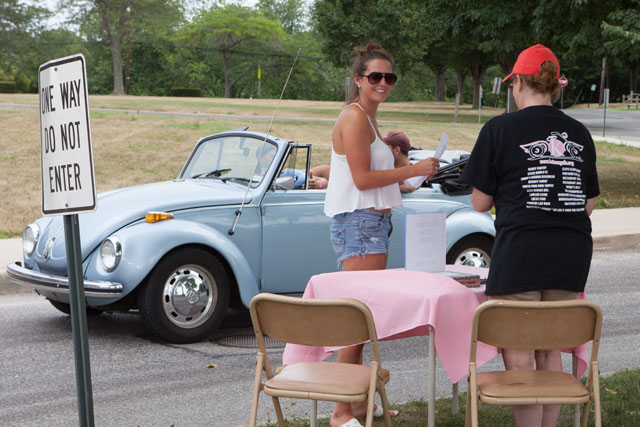 Thea Grenci of Montauk checks in while friends wait in her 1971 VW Super Bug. (Credit: Katharine Schroder)