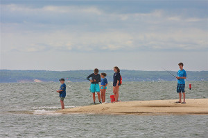 Children fishing at the association's private bay beach. (Barbaraellen Koch)