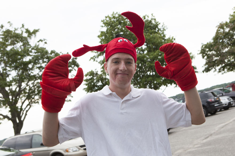 Frank Imbriano, 16, of Southold greeting lobsterfest visitors.