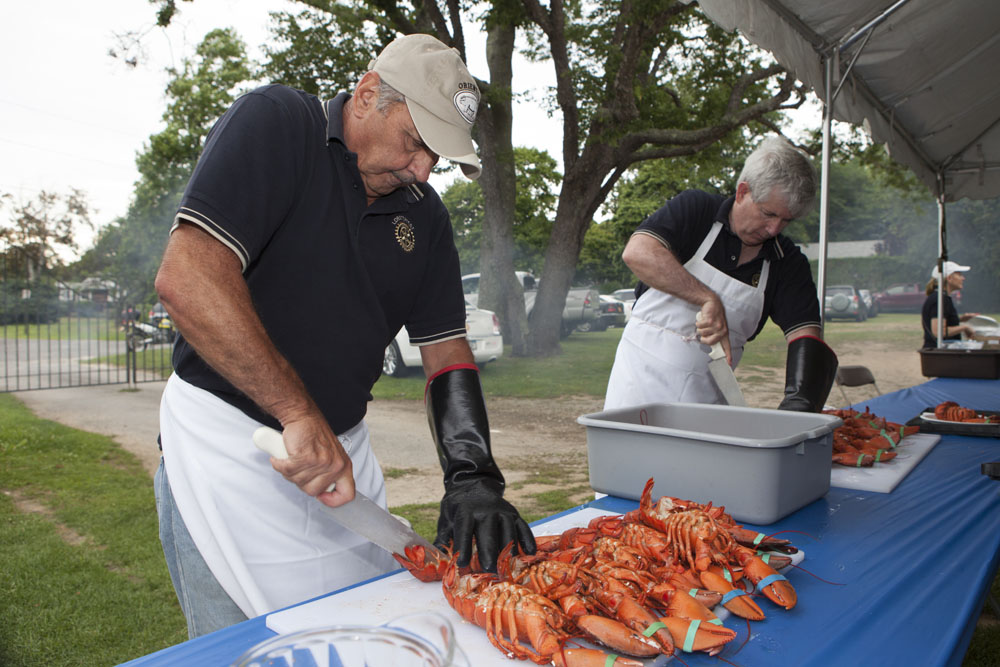 John Sabatino, left, and Kevin McLaughlin cutting lobsters.