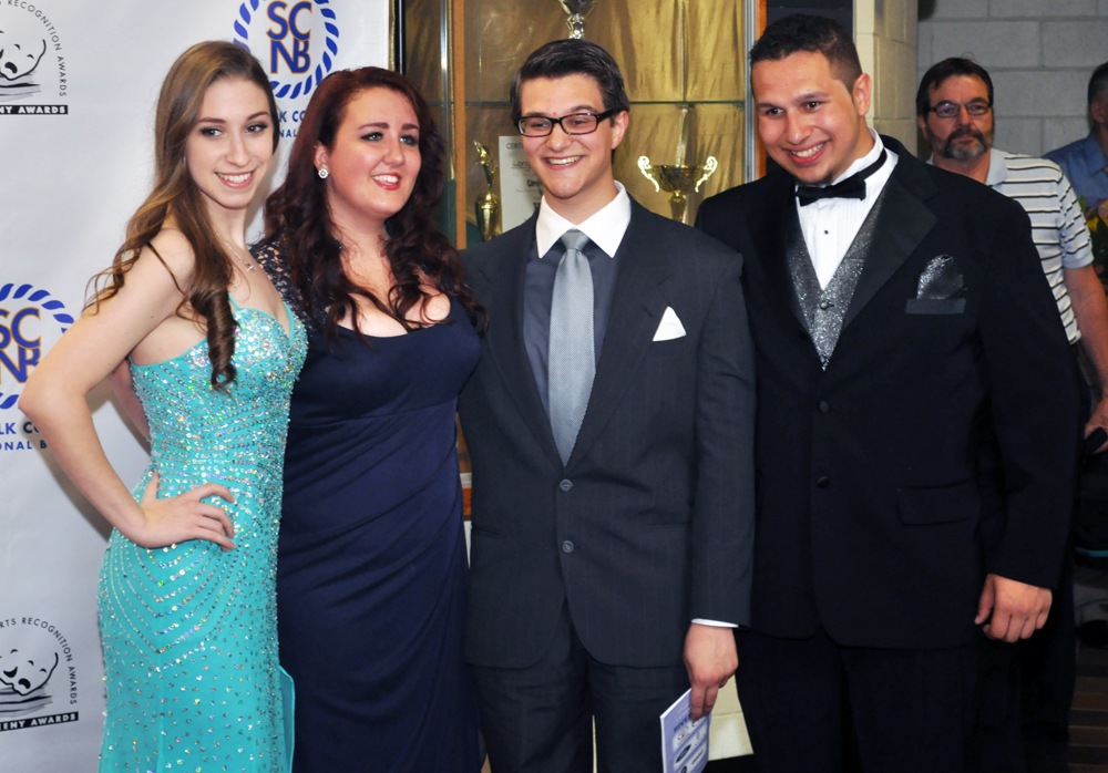 Longwood winners Shannon Muthig, left, and David Letteriello, right, with classmates. (Credit: Grant Parpan)