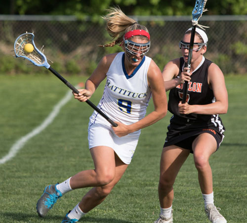 Mattituck/Greenport/Southold's Katie Hoeg, guarded by Babylon's Megan Nerney, had three goals and two assists in the Tuckers' first ever playoff win. (Credit: Katharine Schroeder)