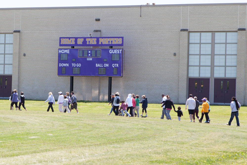 Participants walk past the school at the first Miles for Mike 5K Walk/Run. (Credit: Katharine Schroeder)