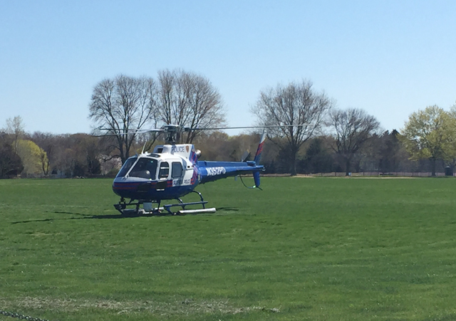 A Suffolk County Police helicopter landed at Southold High School Saturday to transport the victim of an accident. (Credit: Cyndi Murray)