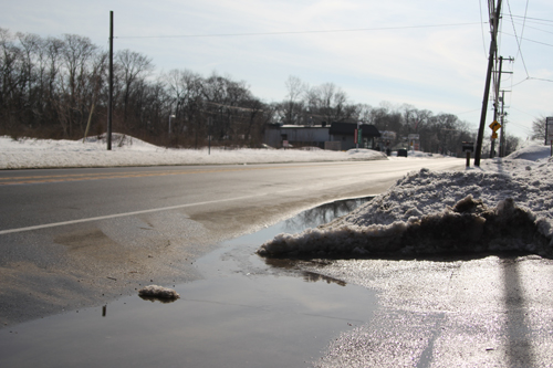 Today's sunshine and warmer temps melted some snow here on Main Road. (Credit: Jen Nuzzo)