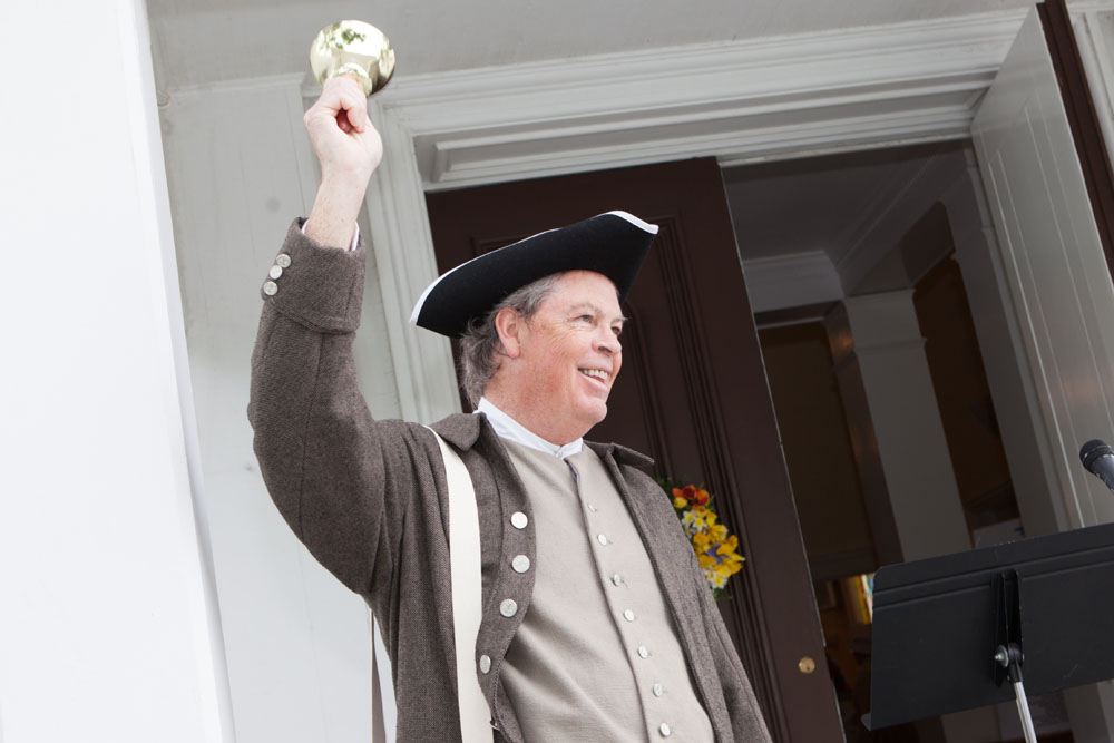 Tom Gahan calls everyone to attention during Saturday's celebrations in Mattituck. (Credit: Katharine Schroeder)