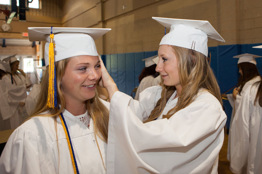Kaylee Bergen gives Olivia Finn a hand before the ceremony. (Credit: Katharine Schroeder)