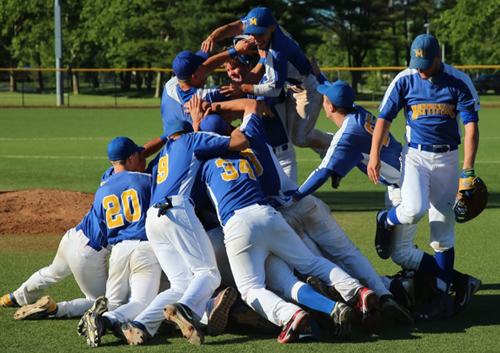 Mattituck players celebrating the team's second Long Island championship in four years following their 9-2 win over Wheatley. (Credit: Daniel De Mato)