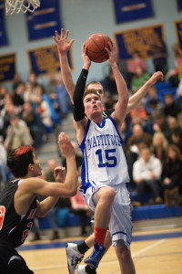 GARRET MEADE PHOTO | Mattituck's Ian Nish, with Babylon's Jacob Carlock behind him and Fernando Vazquez to his right, attacking the basket.