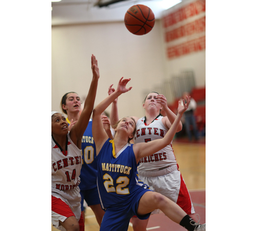 From left, Center Moriches' Tania Rowland, Mattituck's Katie Hoeg and Lisa Angell and Center Moriches' Caroline Casey reach for a rebound. (Credit: Garret Meade)