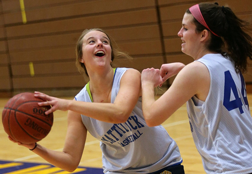 Mattituck's only two seniors, Lisa Angell, left, and Courtney Murphy, during Thursday's practice. (Credit: Garret Meade)