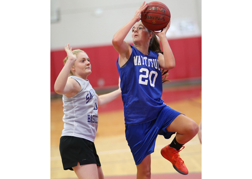 Mattituck freshman Liz Dwyer shooting over Sayville's Molly Andrews during Monday evening's summer league game at Patchogue-Medford High School. (Credit: Garret Meade)