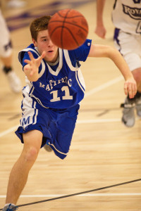 GARRET MEADE PHOTO | Tyler Connell of Mattituck reaching out to collect the ball during Tuesday night's game in Port Jefferson.