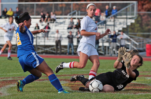 Mattituck's Elvira Puluc tries to get a foot on the ball, only to be thwarted by Center Moriches goalkeeper Megan Ricci. (Credit: Daniel De Mato)