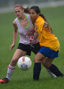 GARRET MEADE PHOTO | Center Moriches' Emily Fey, left, and Mattituck's Jasmine Fell have their eyes on the same prize.