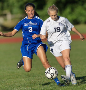 GARRET MEADE PHOTO | Sydney Dunn of Stony Brook gets a foot on the ball before Mattituck's Trish Brisotti can.
