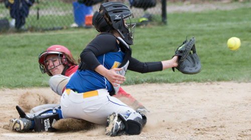 Southold/Greenport's Toni Esposito slides home before Mattituck catcher Rachel Voegel receives a throw home during Friday's game at Mattituck High School. (Credit: Katharine Schroeder)
