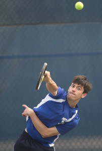 GARRET MEADE PHOTO | Mattituck junior Charles Hickox serving during his first doubles match against Bayport-Blue Point.