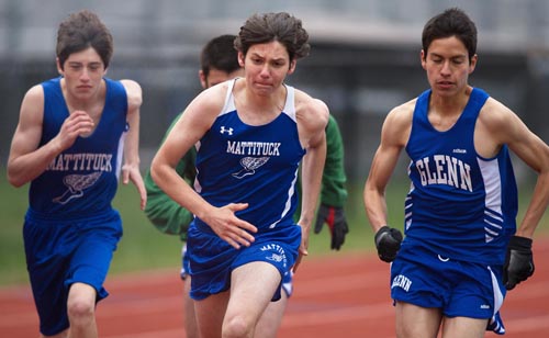 Mattituck junior Jack Dufton, center, shown running in a meet against Elwood/John Glenn last year, has the ability to compete in a variety of events. (Credit: Garret Meade, file)