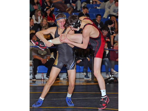 Mattituck's Jack Bokina (black and gold) defeated Connetquot's Danny Colondona (red and black) in the 113 Lbs finals of the North Fork Invitational which were held at Mattituck High School on Jan. 31, 2016.