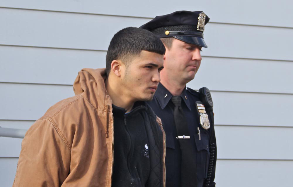 Albino Dejesus Medina is led out of Southold Town Court during his initial arraignment on Nov. 14. He has since been indicted in Suffolk County court. (Credit: Carrie Miller)