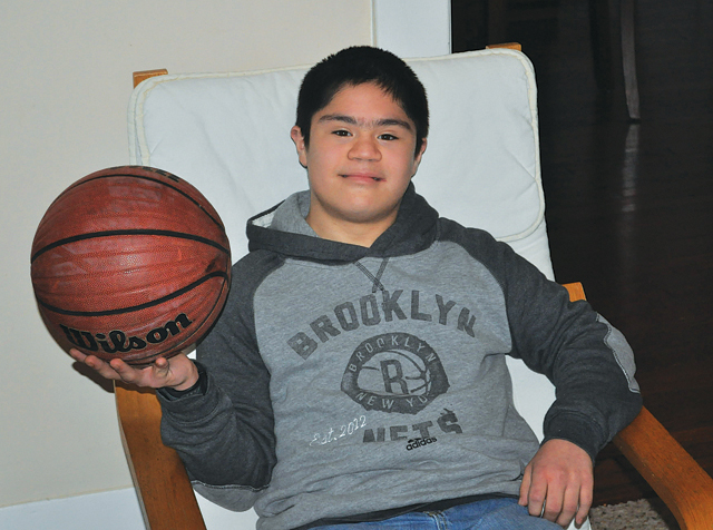 Following an unselfish act from an opposing team and with the support of his beloved teammates Miguel Borrayo, who has Down syndrome, scored the first points of his school basketball career Jan. 8.