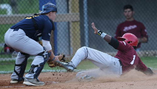 North Fork catcher Chris Gaffney tagging out Montauk's Khalil Denson, who was thrown out on a throw by left fielder Austin Miller in the first inning. (Credit: Garret Meade)