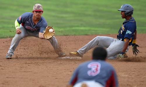 Ospreys Richie Palacios #3 slides safely  into second while Bryce Packard #1 of Montauk waits for the throw at Jean W. Cochran Park in Peconic on July 30, 2016.