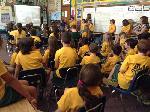 Our Lady of Mercy students talking with author tk. (Credit: Courtesy) 