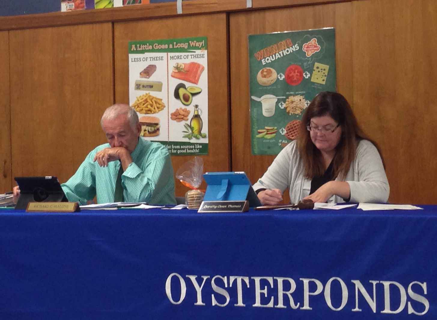 here were two audience members at Tuesday night’s Oysterponds school board meeting in Orient. Most Board of Education meetings on the North Fork have low turnouts. (Credit: Paul Squire, file)