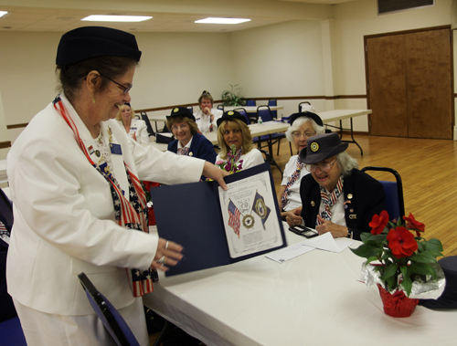 American legion Ladies Auxiliary president Patricia Bianculli presents Evelyn McConlogue of East Marion with an award for her more than 75 years of service. (Credit: Beverlea Walz)