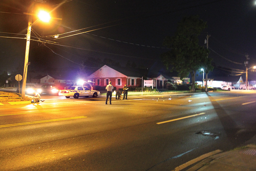 Police at the scene of the fatal hit and run on Route 58 near Woodcrest Avenue in July 2013. (Credit: Paul Squire, file)