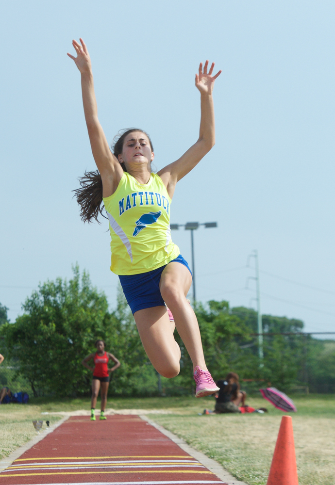 Alya Ayoub competes in the long jump.