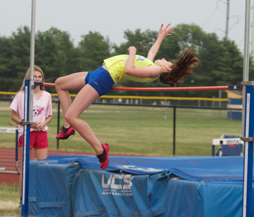 Sam Husak competes in the high jump.