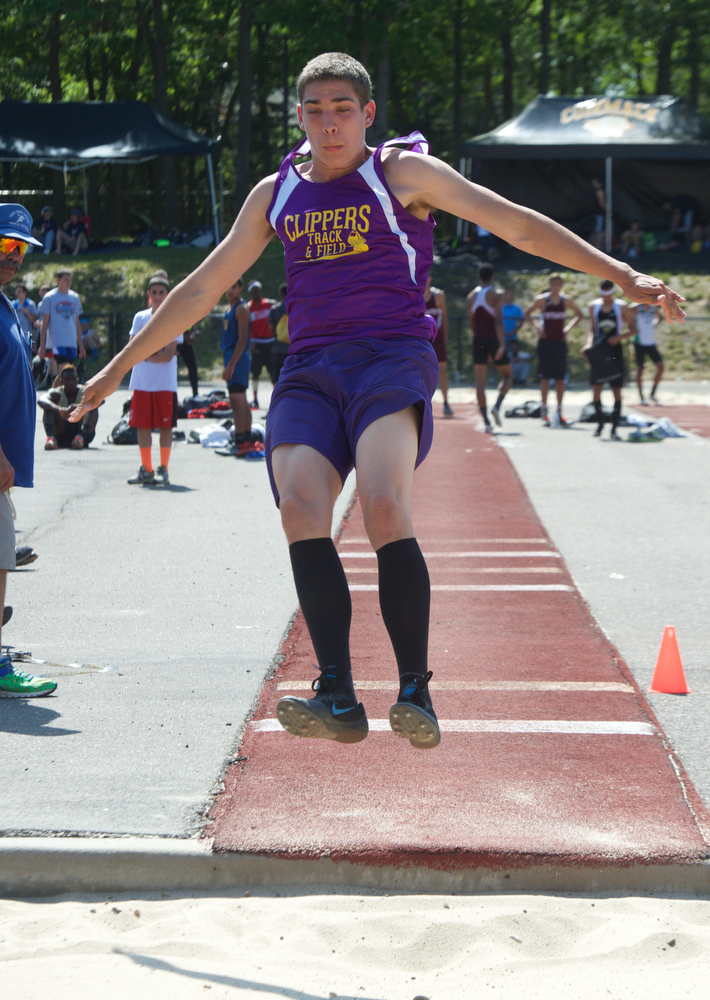Maleik Yoskovich competes in the long jump.