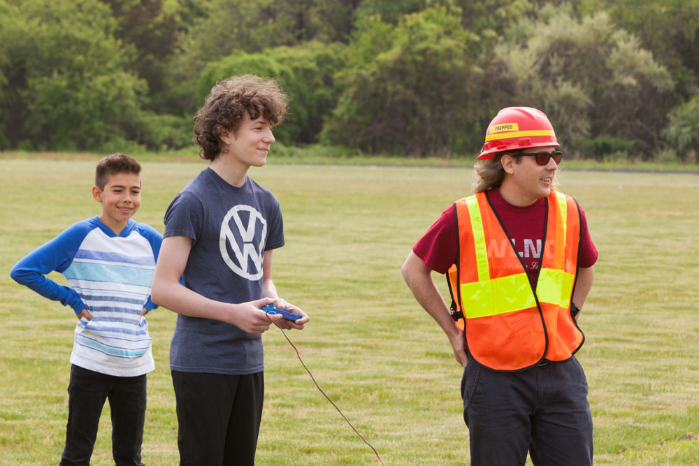 Collin Kaminsky, 15, of Mattituck, center, gets ready to launch his rocket named "It's Just There." (Credit: Katharine Schroeder)
