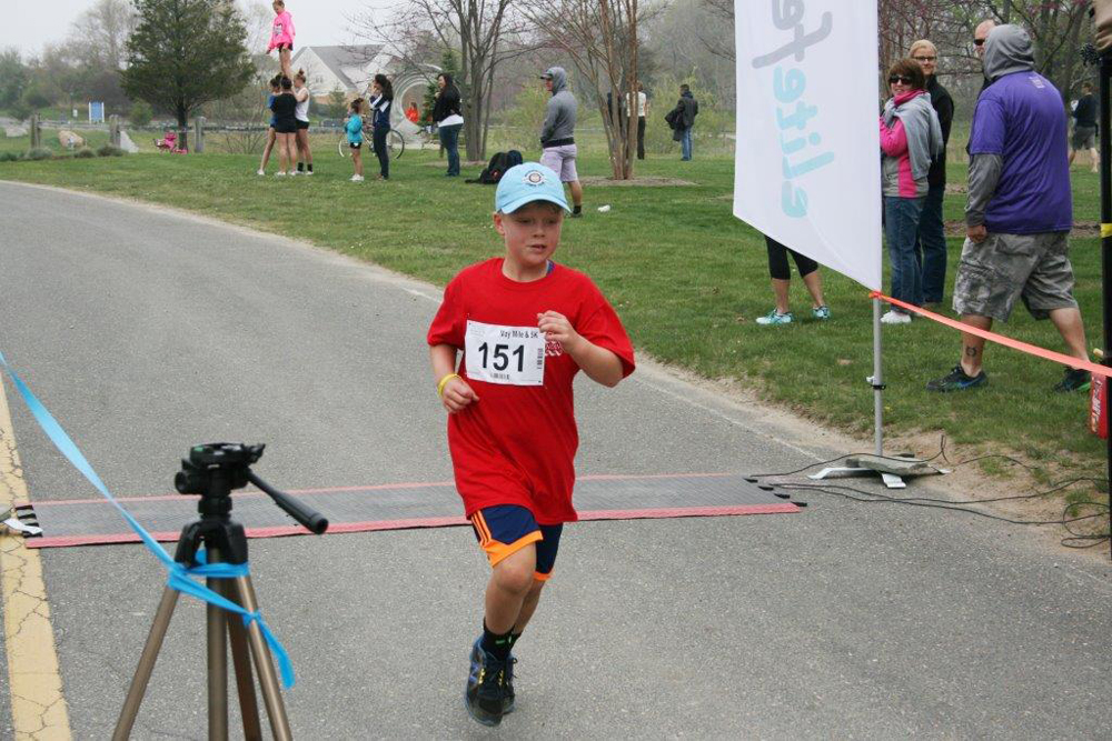 Andrew McKenzie, 8, was the winner of the mile race. (Credit: Robert Styron/Peconic Landing)