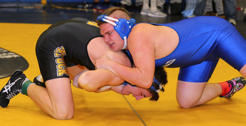 Charles Zaloom of Mattituck (black) defeated Justin Hansel of Riverhead (blue) in the 220 lbs finals of the North Fork Invitational which was held at Mattituck High School on Jan. 31, 2016.