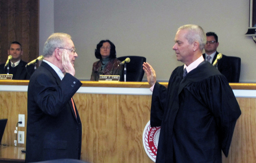 Southold Town Justices Rudolph Bruer, left, and William Price at a swearing in ceremony.
