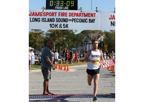 Kevin Harvey, a miler from Sag Harbor, never ran in the Sound to Bay 10K before, but that didn't prevent him from winning on Sunday morning. (Credit: Daniel De Mato)