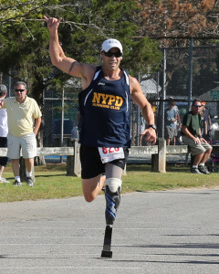 DANIEL DE MATO PHOTO | Tommy Kohler of Hampton Bays, running with a prosthetic left leg, took second place in the 5K race.