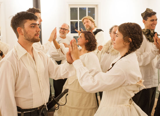 Oliver Orr as Orlando and Elena Faverio as Rosalind and the cast of "As You Like It" during rehearsal. (Credit: Katharine Schroeder)