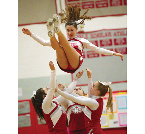 Southold cheerleaders perform during a basketball game this past winter. (Credit: Garret Meade)