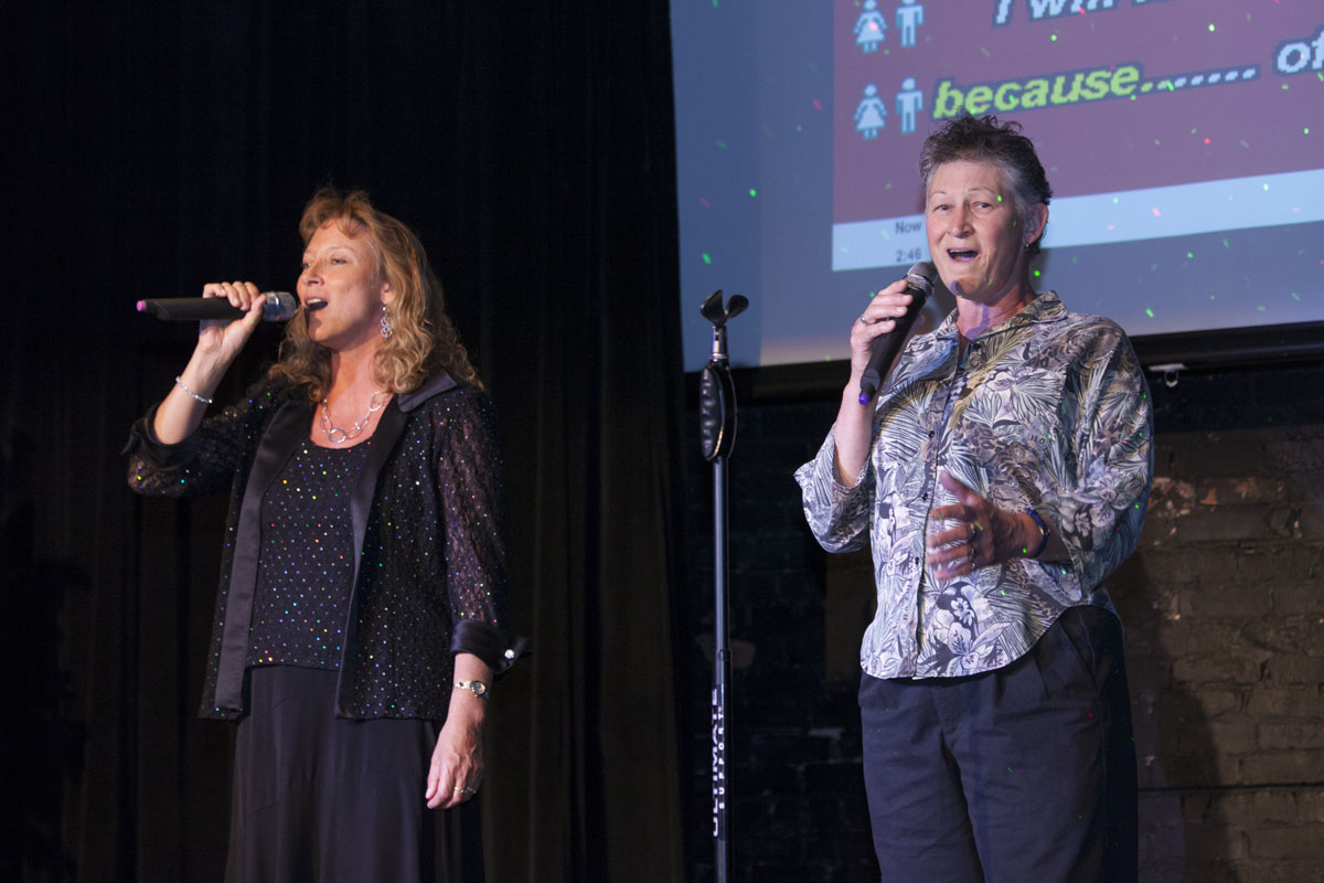 Sisters Diane Hoefer, left, of East Quogue and Judy Dealney of Westhampton Beach sing a duet. (Credit: Katharine Schroeder)